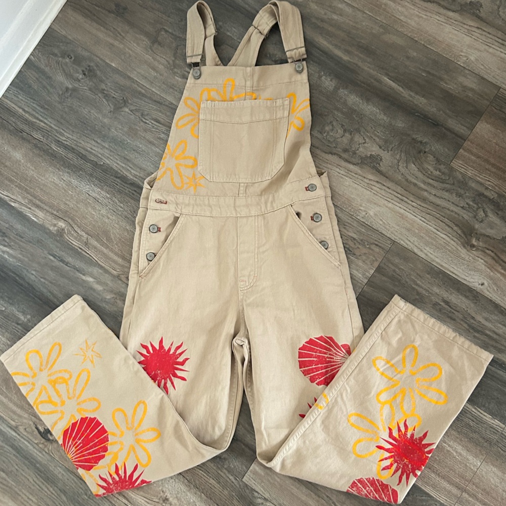 Free People Tan Overalls with Red and Yellow Floral Design